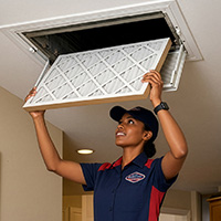 Goettl technician changing an air filter