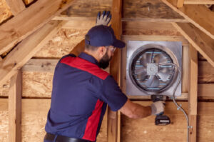 Goettl technician servicing an attic fan