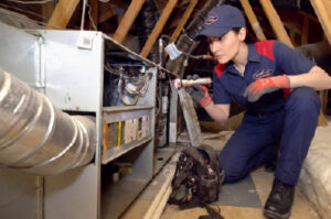 Goettl technician conducting a rejuuuvenation on a furnace