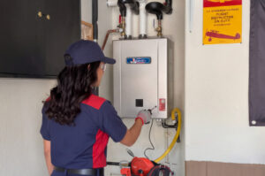 Goettl technician installing a tankless system