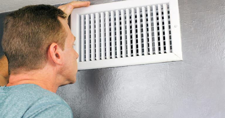 Man Checking Leaky Ducts