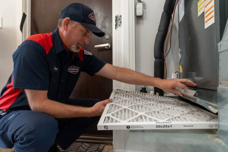 Goettl technician replacing a furnace filter