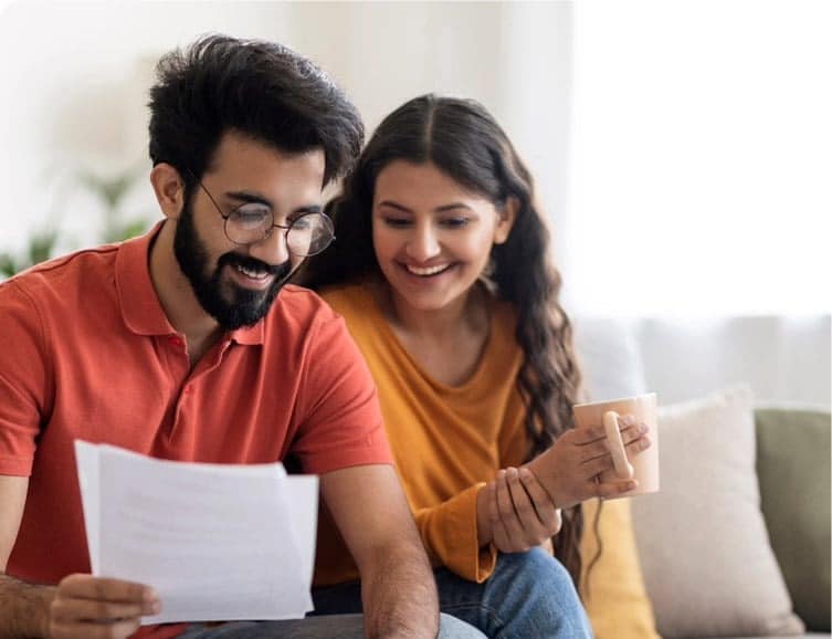 couple on couch balancing budget promo get pre approved