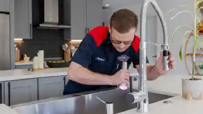 Goettl technician inspecting a sink