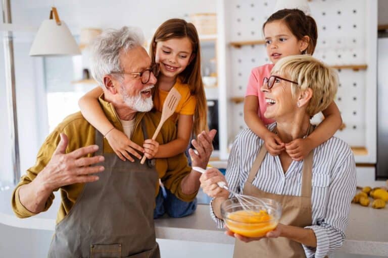 happy grandparents and grandkids in a kitchen