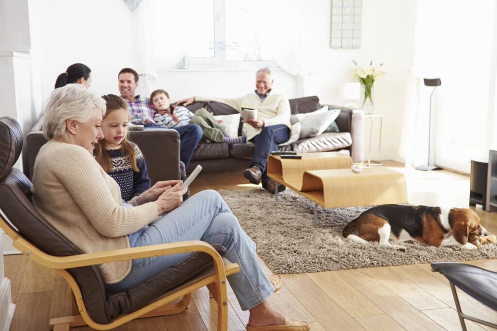 happy multi generational family living room after a new furnace installation from goettl