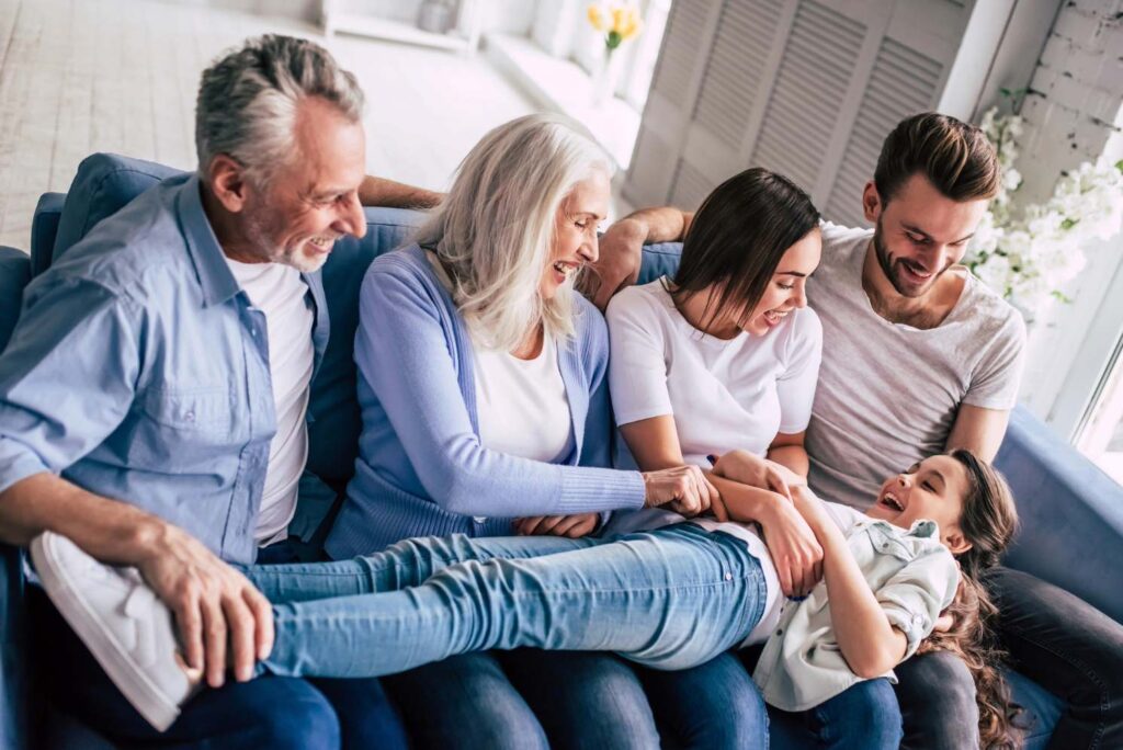 happy multi generational family on couch after goettl furnace replacement service
