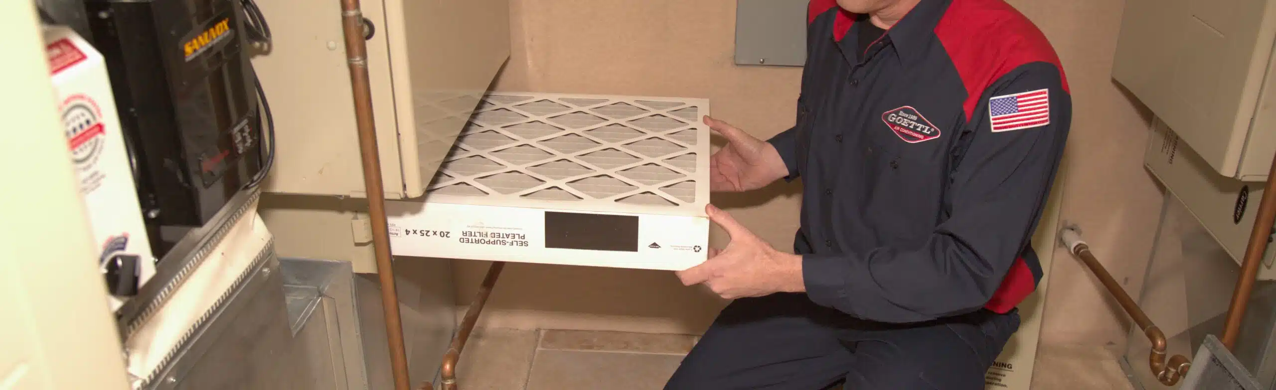 Goettl Technician replacing duct filter